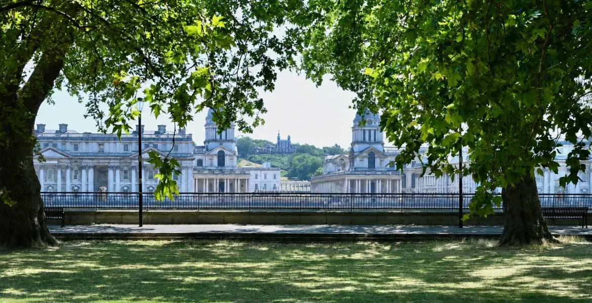 The Old Royal Naval College buildings in Greenwich, viewed across the Thames from Island Gardens